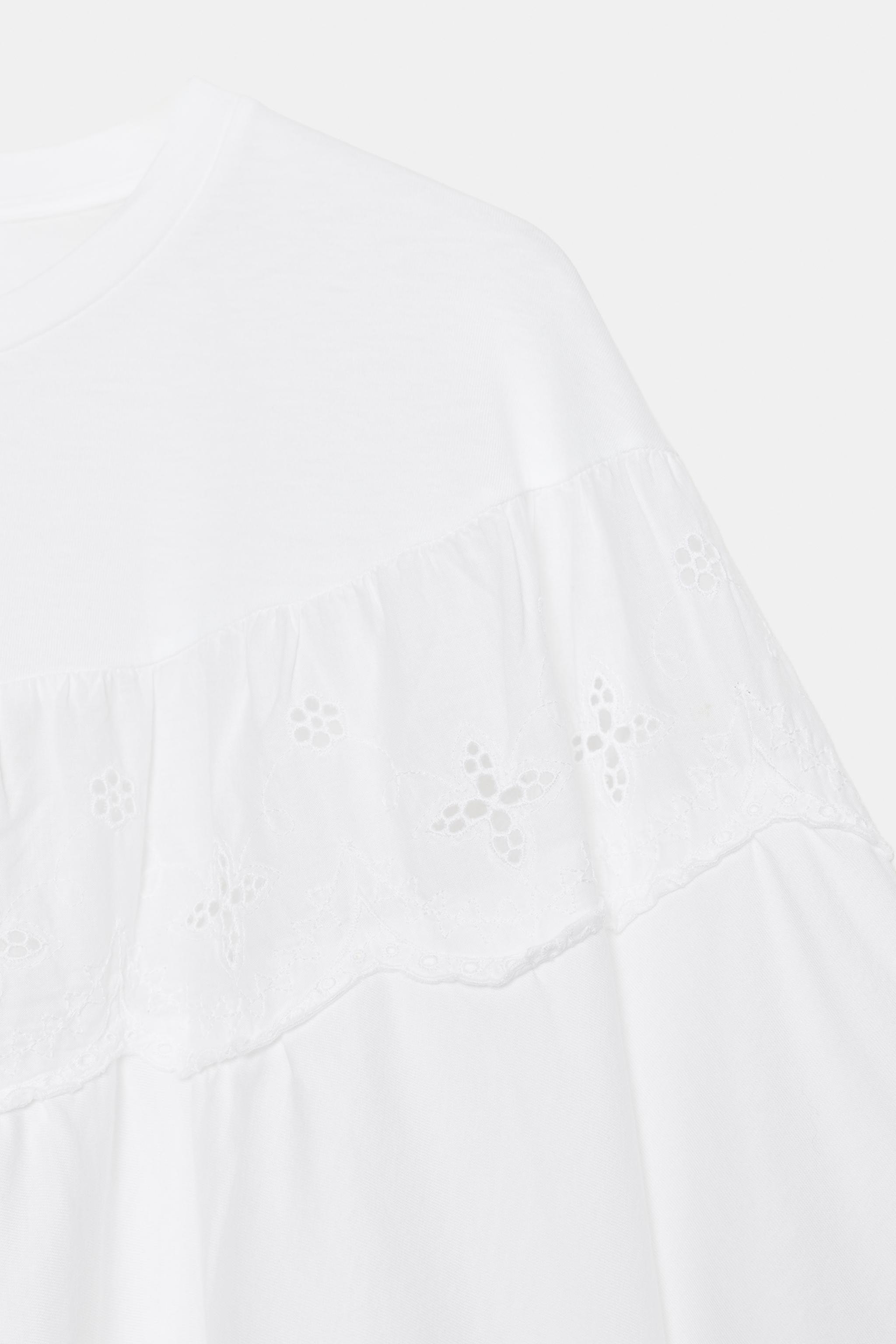 EMBROIDERED CAPE TOP